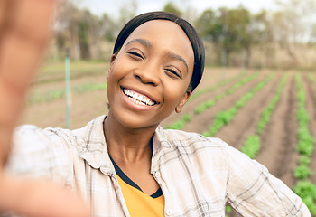 Image showing Agriculture, farm and selfie of happy black woman smiling and taking picture outdoors. Agro, sustainability and self portrait of female farmer for social media or internet post after checking plants.