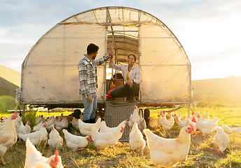 Image showing Chicken farmer, countryside farm and sustainable agriculture livestock farming for healthy egg harvest sustainability. Modern couple in nature, animal planning and organic agricultural poultry health