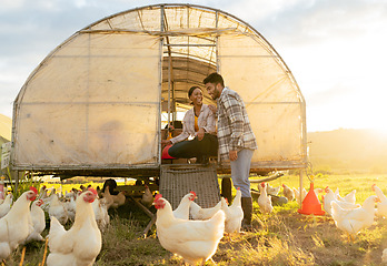 Image showing Farm, chicken and man and woman on agriculture field in the countryside for hen farming in summer. Poultry, farmer and farming multiracial couple on ranch for sustainable environmental harvest