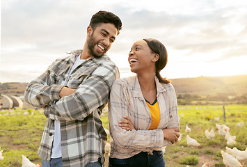 Image showing Farming, poultry and farmers outdoors with chicken on field, standing with crossed arms. Sustainability, support and man and woman working on poultry farm for organic, healthy and natural livestock