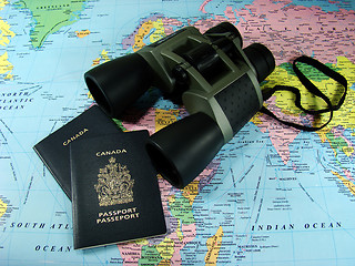 Image showing Binoculars, map and travel passports