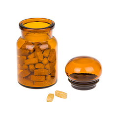 Image showing Full vintage apothecary bottle with pills and closed lid