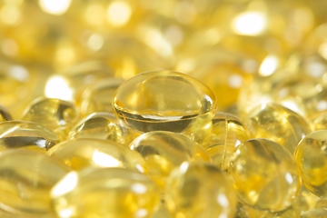 Image showing Fish oil capsules spilled to make a background