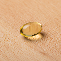 Image showing Fish oil capsule laying on a table