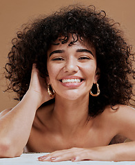 Image showing Skincare, hair and natural portrait of black woman happy with beauty, smile and freckles on face. Health, wellness and curly model for hair care or facial cosmetics campaign in brown studio.
