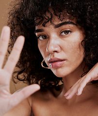 Image showing Hand, portrait and woman in studio for skincare, beauty and wellness, sexy and attitude. Face, skin and girl model showing stop hand sign, saying no to ageing and satisfied with natural product