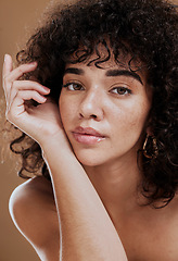 Image showing Skincare, hair care and face of woman with beauty, makeup and cosmetics against a brown studio background. Wellness, luxury and portrait of a girl model at a spa or salon for hair or natural skin