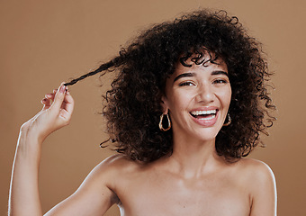 Image showing Hair care, growth and woman excited about health, wellness and clean shampoo against a brown studio background. Salon, smile and portrait of a model with hair beauty and shine from hairdresser