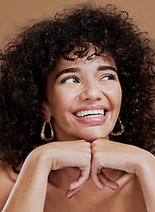 Image showing Face, makeup and woman thinking of hair care, beauty and cosmetics against a brown studio background. Cosmetic, dermatology and a young model with an idea and vision for hair and cosmetology