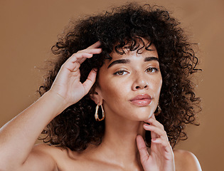 Image showing Beauty, face and hands with woman in skincare portrait, curly hair and healthy skin against studio background. Natural cosmetics, makeup and clean, fresh glow with cosmetic treatment and facial.