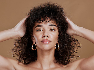 Image showing Hair care, black woman and portrait with curly hair, beauty and wellness by cosmetics background. Hair, model and jewelry earrings with cosmetic skin glow with makeup, gold jewellery and radiant face