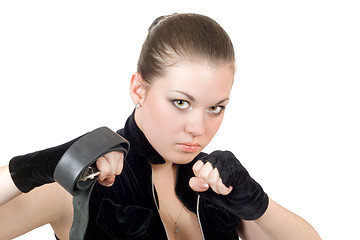 Image showing Pretty young angry woman throwing a punch