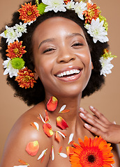 Image showing Flowers crown, beauty and portrait of black woman with smile on brown background in studio. Hair care, cosmetics and happy girl model for natural, organic and healthy hair products for afro in spring