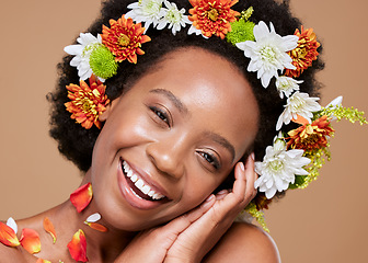 Image showing Beauty, art and black woman with flower crown in hair and smile on face, portrait with studio background. Nature, happy woman with flowers, natural skincare or hair care with sustainable ingredients.