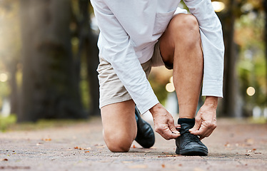 Image showing Workout, fitness and man tying shoes on feet, running on garden path, healthy exercise in nature. Health, wellness and sports footwear, motivation for exercise for runner on morning training routine.