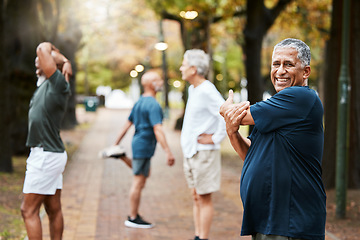 Image showing Fitness, exercise and stretching with a senior man getting ready for a workout or training outdoor at the park. Health, wellness and performance with elderly male at the start of his routine in group