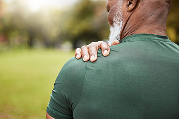 Image showing Shoulder, pain and injury with a senior black man holding his joint, sore with inflammation outdoor during exercise. Fitness, workout and anatomy with a mature male athlete suffering from an accident