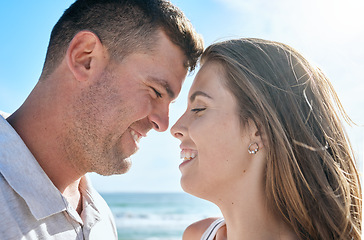 Image showing Couple, love and happy smile at beach, holiday and anniversary travel in summer with romance in Ibiza. Young man and woman enjoy marriage, happiness and content together outdoor at a ocean vacation