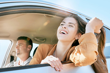 Image showing Couple, road trip and smile out car window on road for drive, transport or summer adventure. Man, woman and happy while driving, street or journey with happiness on travel, holiday or vacation in sun