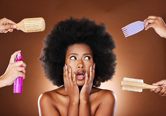 Image showing Black woman thinking of hair care, tools for natural afro and decision making of beauty products. Shocked african girl with choices, salon brushes and hairspray in studio with dark brown background