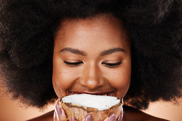 Image showing Closeup beauty, coconut and black woman in studio with skincare, healthy glow and smile on face. African, model and natural makeup with fruit for cosmetics, wellness or health with hair by background