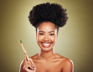 Image showing Wooden toothbrush, black woman and portrait for eco friendly self care, beauty or cosmetics with smile. Model, woman and african for dental, healthcare or organic teeth whitening by studio background