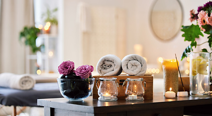 Image showing Spa, luxury and wellness room at a resort for relax, peace and beauty massage for health and wellness. Empty, flowers and candles for rest, stress relief and healing at a zen calm center or salon.