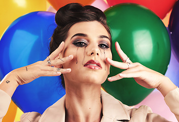 Image showing Face, beauty and makeup with a model woman in studio against a balloon background for fashion or style. Portrait, party and sad with an attractive young female posing with balloons at a birthday