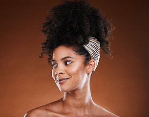 Image showing Beauty, skincare and haircare with a model black woman in studio on a brown background thinking about treatment. Cosmetics, afro hair and idea with an attractive young female with natural skin