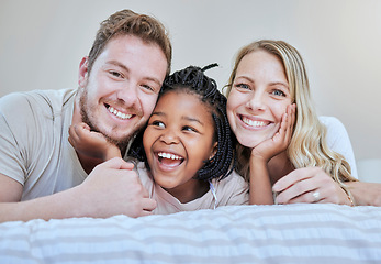 Image showing Diversity, happy family or foster parents in bedroom relax, happy or family love portrait in house or home. Mother, father and black girl with smile on bed for happiness, quality time or support