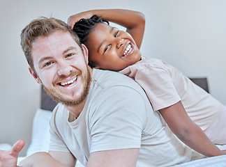 Image showing Interracial, father and daughter in bedroom portrait, happy or smile back touch for bonding. Diversity, multicultural family and girl with dad, adoption and bed with laugh, play or comic time in home