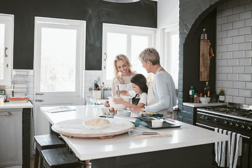 Image showing Grandmother, mother and child baking in the kitchen together while bonding in the family home. Senior woman, mom and girl kid cooking food for dinner or lunch for party, celebration or event at house