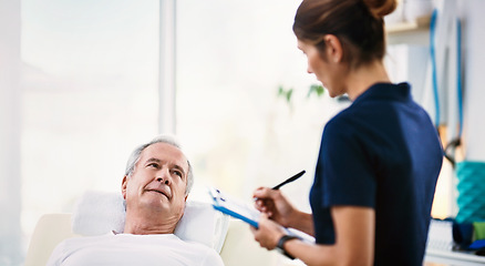 Image showing Senior man, healthcare worker and patient rehabilitation while writing on a clipboard for physiotherapy assessment with a doctor. Woman chiropractor with male for physical therapy, physio and help