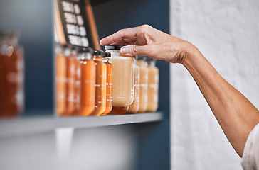 Image showing Honey, product and retail with hands of woman for natural, supermarket and grocery shopping shelf. Food, health and sustainability with organic store employee for small business, sale and choice