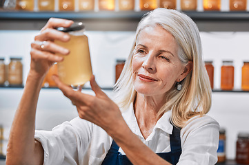 Image showing Small business, elderly woman and honey store owner for raw, natural and organic product, proud and happy. Sustainable business, market and senior woman with glass jar of healthy, syrup and nutrition