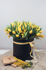 Image showing Bright spring bouquet of tulips and mimosa flowers