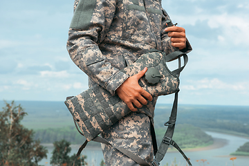 Image showing Man tourist standing in military outfit outdoor