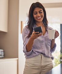 Image showing Woman, phone and smile with coffee for communication, chatting or social media in the kitchen at home. Happy female smiling and enjoying drink while texting on mobile smartphone app in conversation