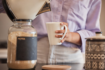 Image showing Water, drink and woman make coffee in kitchen for motivation, energy and caffeine in morning. Lifestyle, cafe and closeup of hands pouring water from kettle to mug for hot beverage, espresso and tea