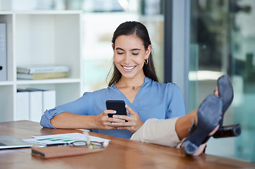 Image showing Smile office and phone, typing with feet up on desk, relax while surfing internet or social media with smile on face. Communication, smartphone and happy businesswoman ceo writing text while on break