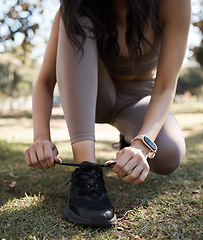 Image showing Fitness, running and woman tie shoes in grass of park for training, workout and ready. Exercise, health and wellness with girl runner and start for cardio, sprinting or endurance jogging in nature