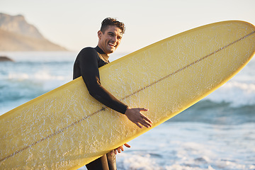 Image showing Portrait, man and surfing board, beach and summer training, freedom and happiness outdoors in South Africa. Portrait of happy surfer guy, ocean and sea water, relax and happiness for nature adventure