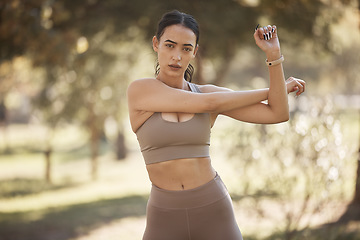 Image showing Woman, park portrait and stretching for exercise, workout or running with smartwatch, outdoor and focus. Runner, warm up and wellness in summer sunshine for workout, fitness and training for health