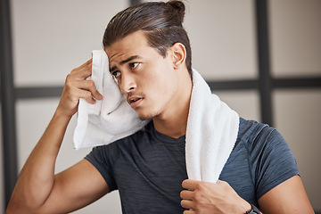 Image showing Fitness, man sweat and tired fo exercise, training and fatigue in gym for health and wellness with towel. Man, young and gen z in sport club, healthy or workout with cloth for dry, sweat or skin