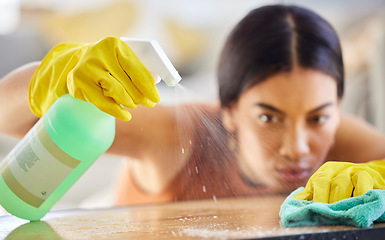 Image showing Spray bottle, cloth and woman cleaning table from bacteria, germs or dirt with disinfectant liquid. Housekeeping, hygiene and maid or cleaner with chemical to wipe dust on furniture in home or office