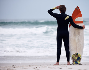 Image showing Sports, fitness and surf with man at beach with mockup for training, workout or relax. Summer, exercise and ocean with athlete surfer in sand ready for tropical, vacation and cardio on travel holiday