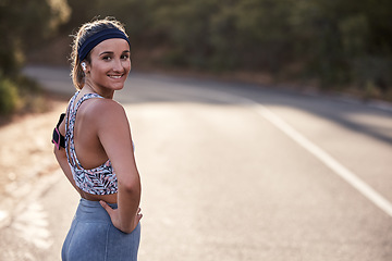 Image showing Woman, earphones or fitness arm band in nature environment, sustainability mountain road or remote trail. smile portrait, happy runner or sports coach athlete with workout, training or exercise radio