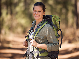 Image showing Hiking, backpack and woman in forest portrait for journey, travel and adventure in nature with sports, fitness and wellness gear. Woods, trees and nature athlete smile, walking or trekking outdoor