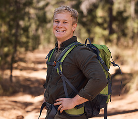 Image showing Hiking forest, fitness and portrait of man trekking in woods for freedom, peace or adventure journey for body wellness. Exercise travel, training workout and backpacking hiker walking on nature path