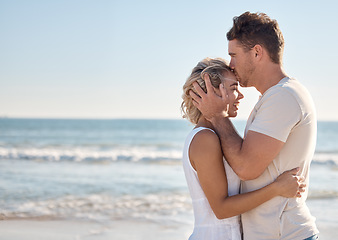 Image showing Beach hug, love and couple kiss forehead on romantic Sydney Australia mockup, bonding vacation or holiday freedom. Ocean peace, mock up blue sky and marriage partnership of man and woman on honeymoon